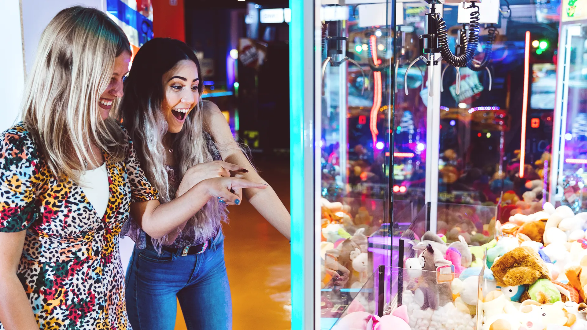 happy-women-playing-arcade-machine copy